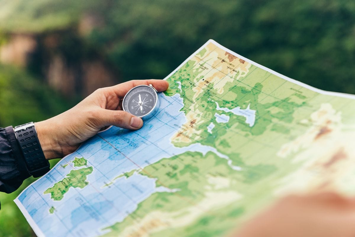 compass and map in hands of a traveler