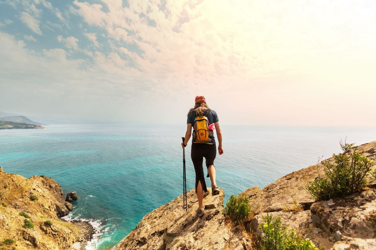girl hiking near coast line